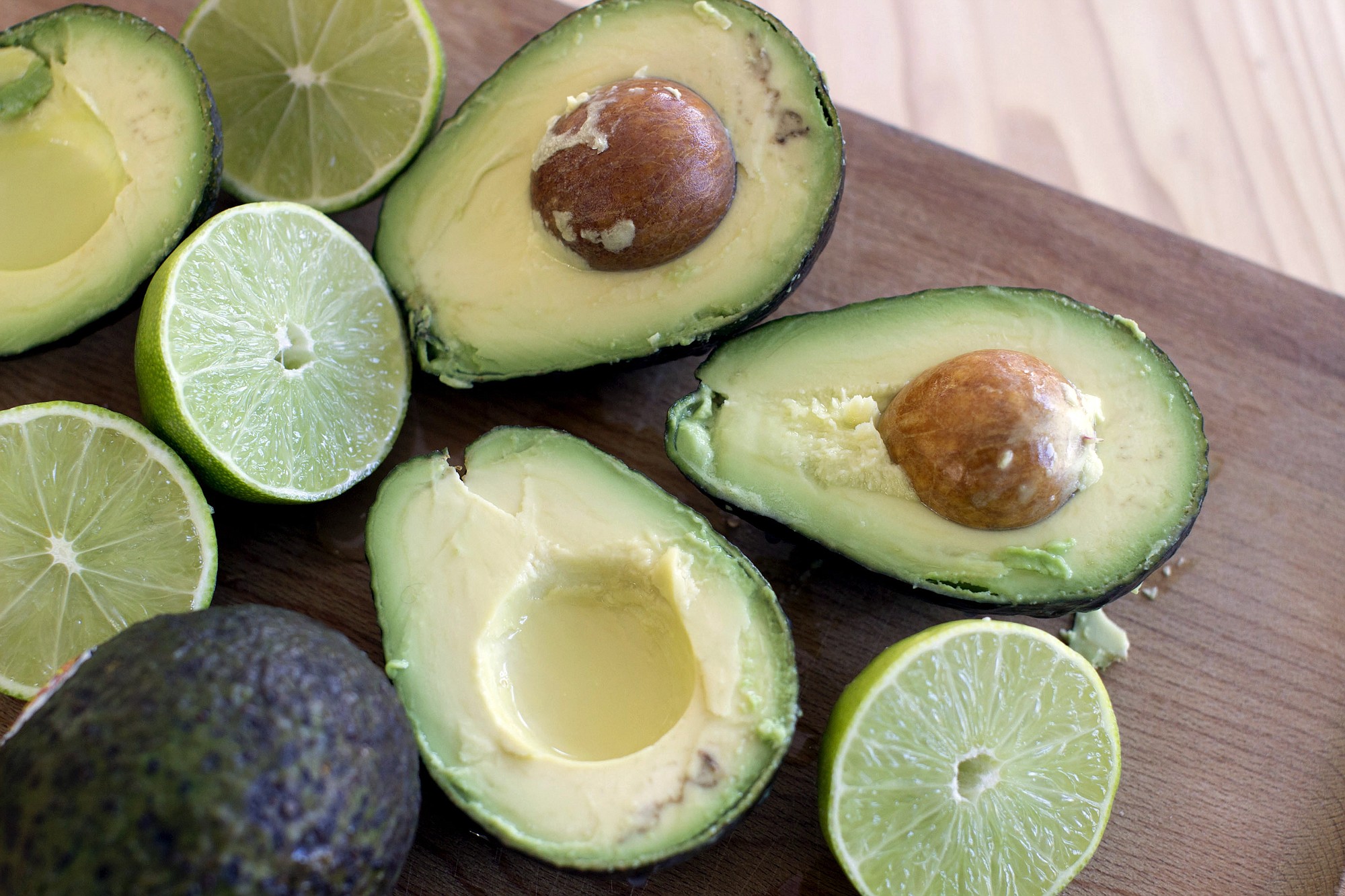 Avocados and limes, key ingredients for guacamole