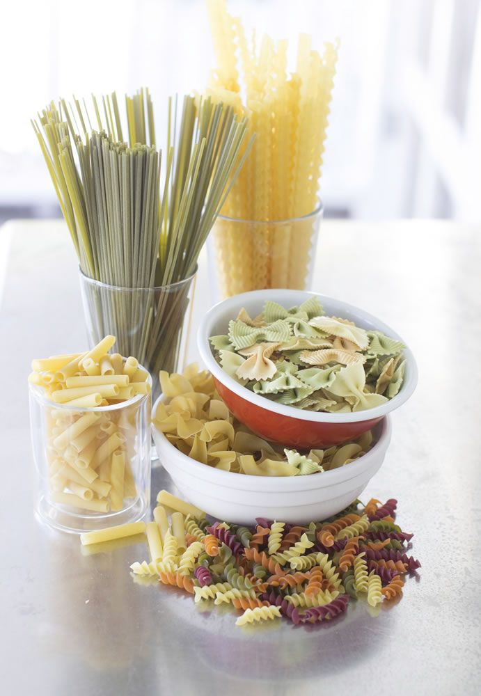 An assortment of pastas, from top clockwise, Pastene mafaldine 5, Rao's tre-carfalle farfalle, NoYolks dumplings, WackyMac veggie spirals, DeCecco zita cut, DeCecco linquine with spinach.