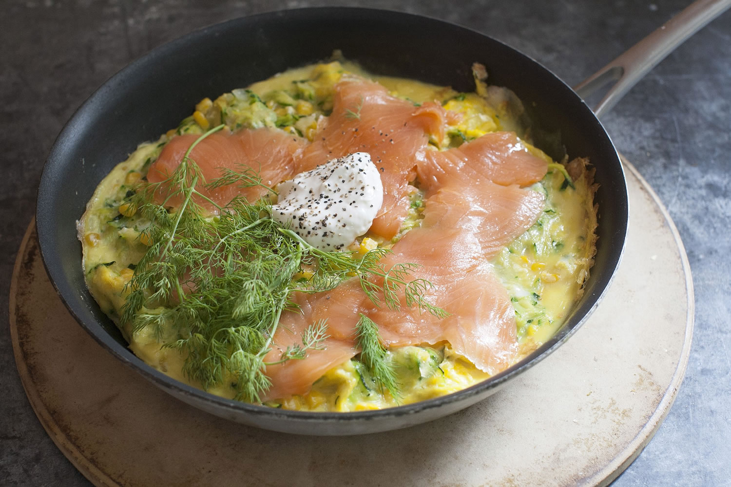 An Open Faced Corn And Zucchini Omelet With Smoked Salmon