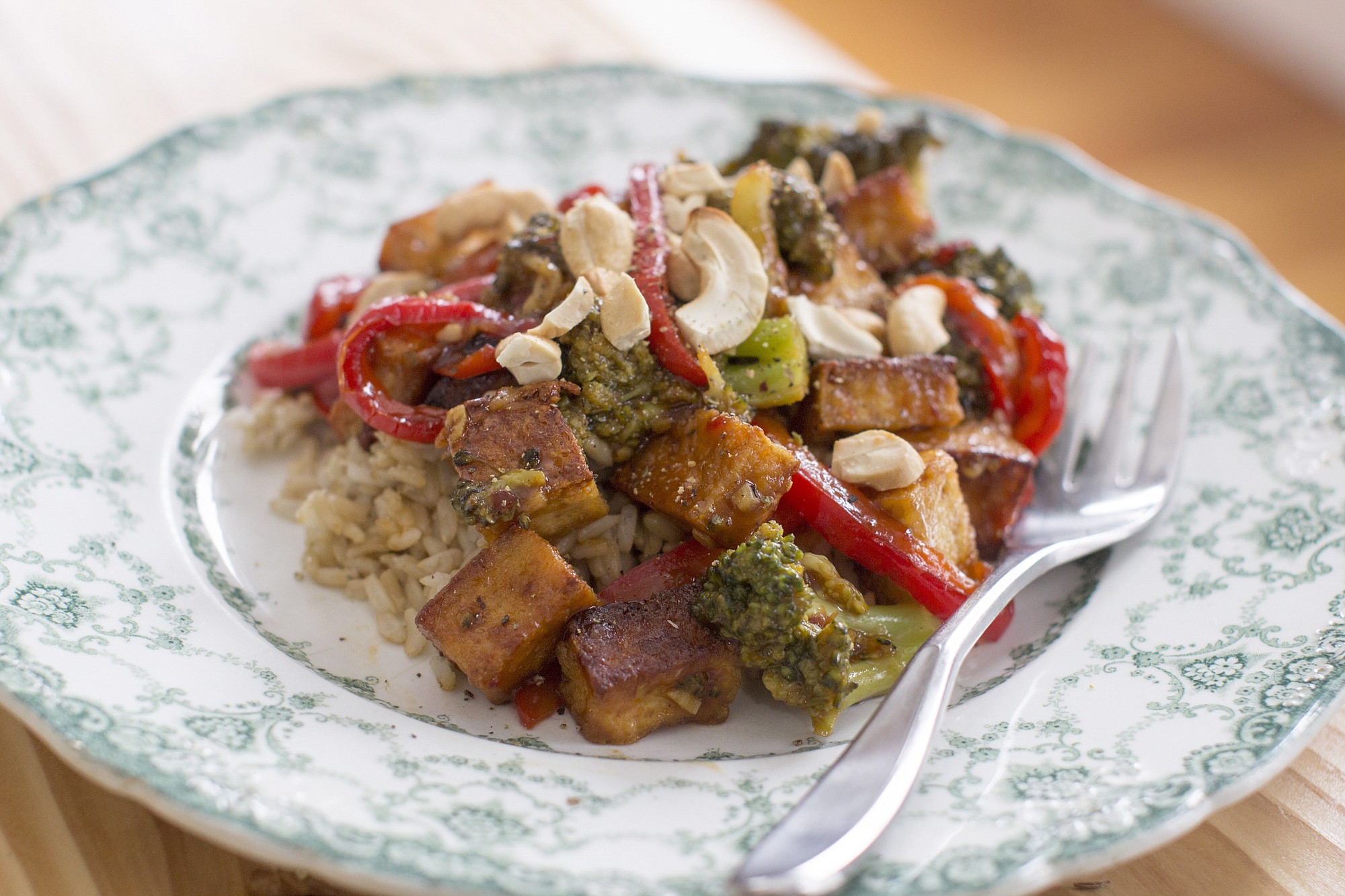 Sauteed tofu with broccoli and red peppers in chili-orange sauce
