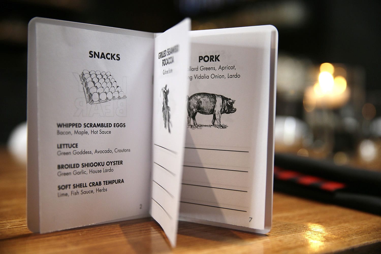The evening's menu is displayed in a field guide with room for tasting notes at the Lazy Bear restaurant in San Francisco.