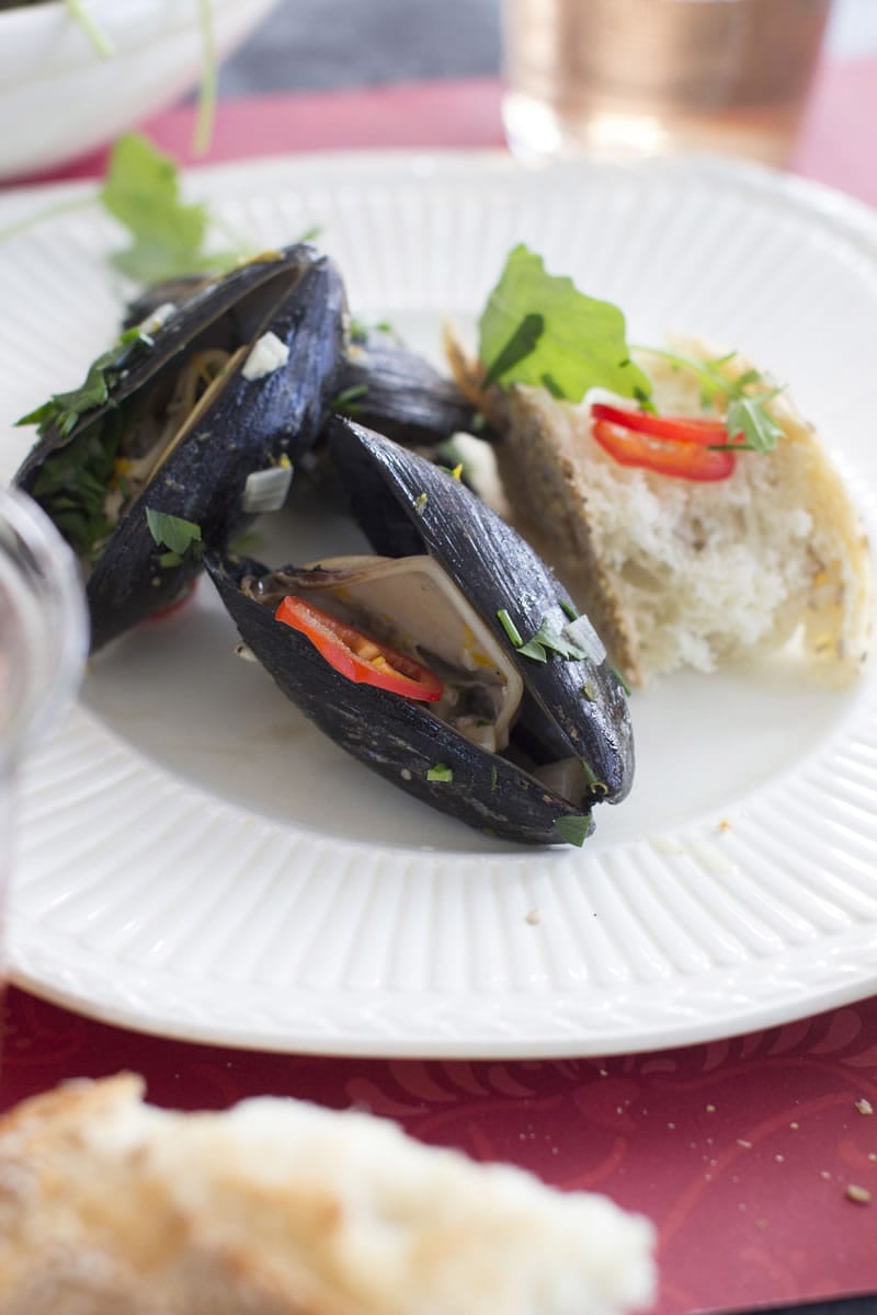 Mussels in Dijon Orange Sauce With Arugula are a quick and lovely treat for Valentine's Day.