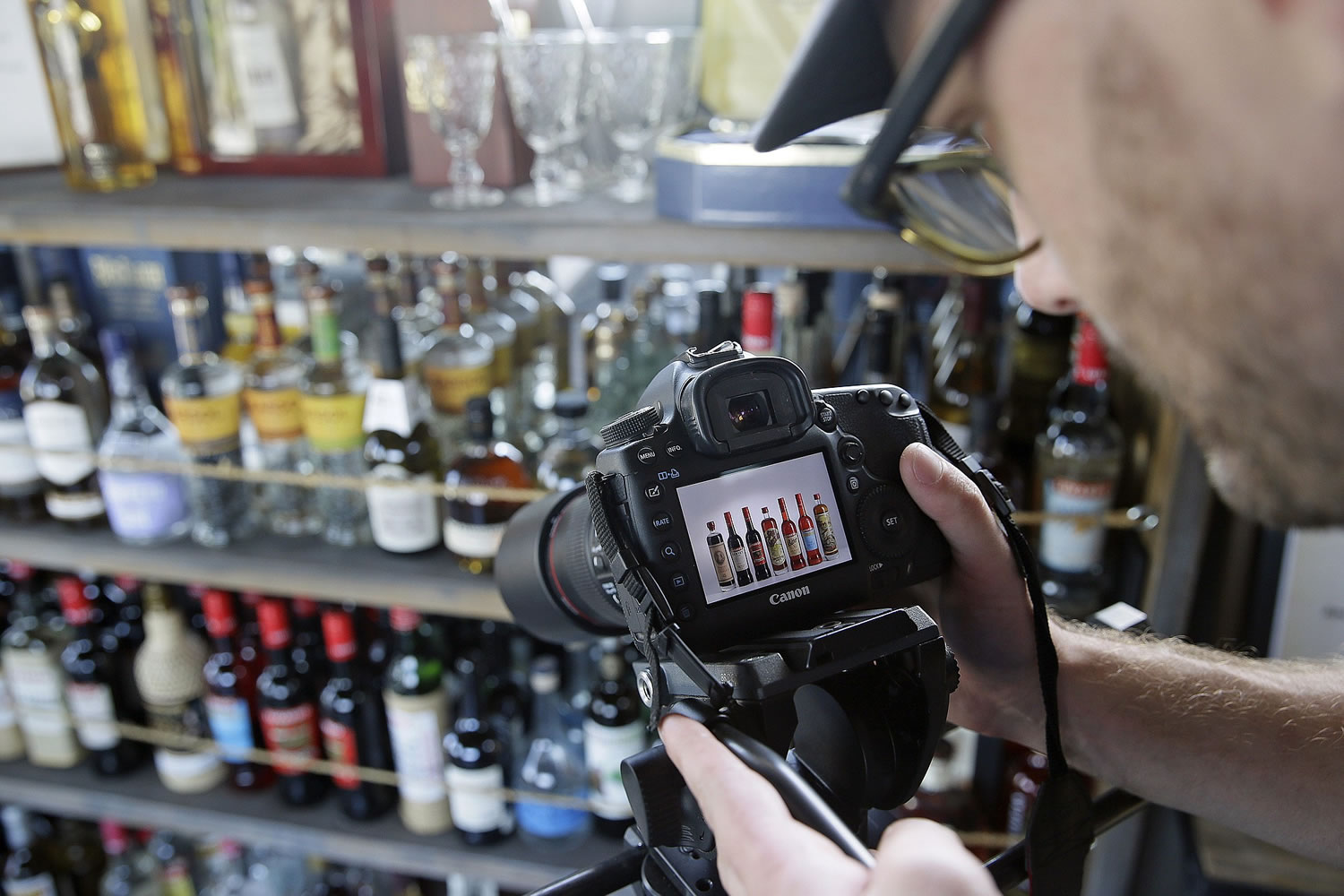Alan Kropf, director of education, shoots an educational video for brand promotion July 30 at the Anchor Distilling Company in San Francisco.