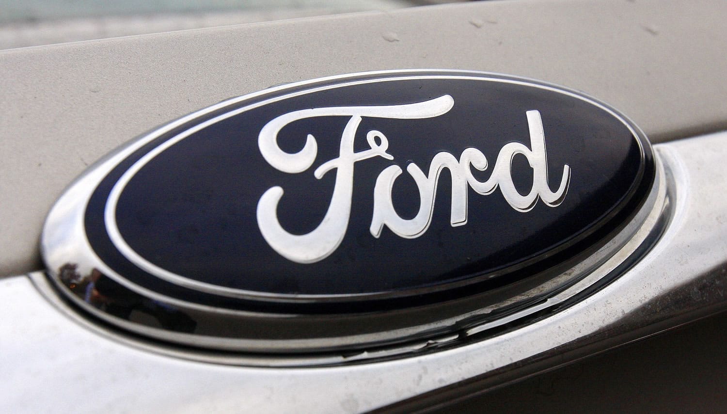 A Ford nameplate on a Ford Fusion in Newton, Mass.