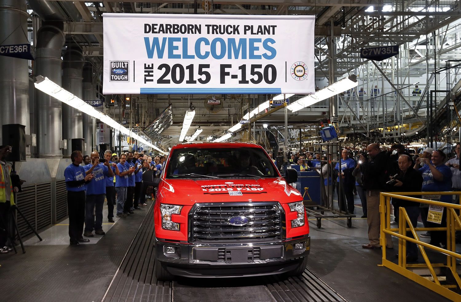 A 2015 aluminum-body Ford F-150 truck is driven off the production line Nov.