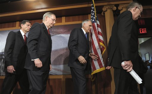 Senate Minority Leader Mitch McConnell of Ky., second from left, and fellow Senate Republican Senators, leave a news conference on Capitol Hill in Washington, Tuesday, July 12, 2011. From left are, Sen. John Barrasso, R-Wyo., McConnell, Senate Minority Whip Jon Kyl of Ariz., and Sen. Lamar Alexander, R-Tenn.
