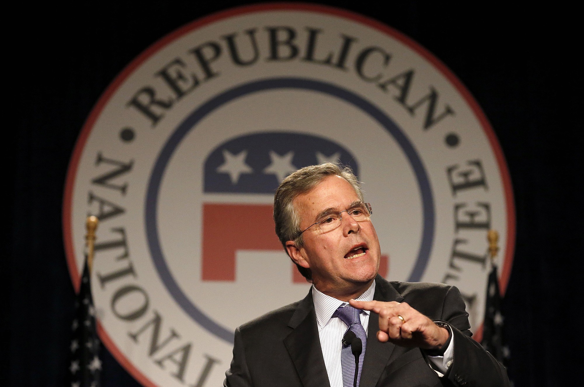 Former Florida Gov. Jeb Bush speaks Thursday at the Republican National Committee spring meeting in Scottsdale, Ariz. For more than four hours, Bush worked his way through the dimly lit hallway of an Arizona resort, shuttling from one room to the next, meeting with dozens of Republican officials, many for the first time.