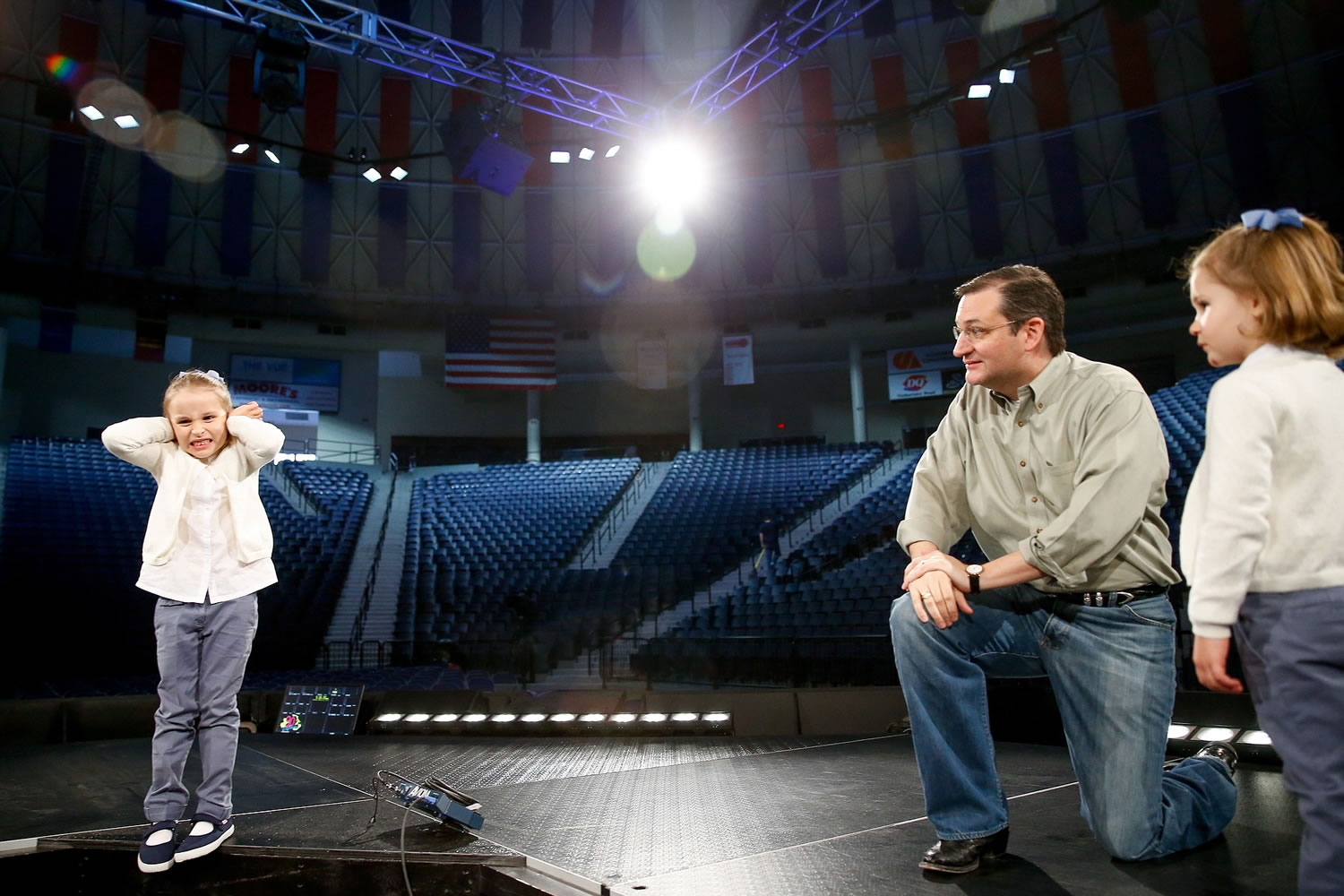 Caroline Cruz, 6, pretends to react to noise as Sen. Ted Cruz, R-Texas, tells her and her sister, Catherine, 4, right, how loud and crowded it will be for Cruz's Monday morning speech where he is expected to launch his campaign for U.S. president, during a walk-through on stage at Liberty University on Sunday in Lynchburg, Va.