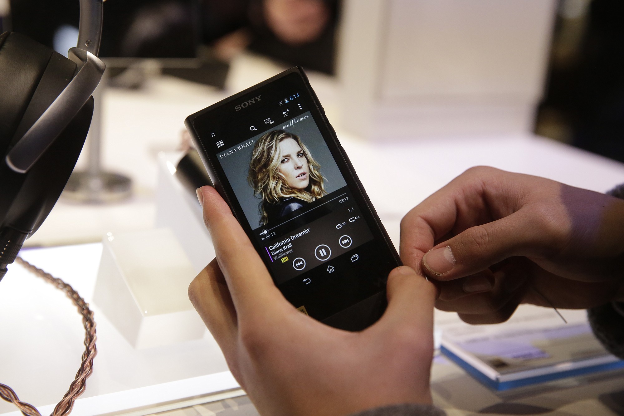 An attendee holds Sony's new Walkman at the Sony booth Jan.