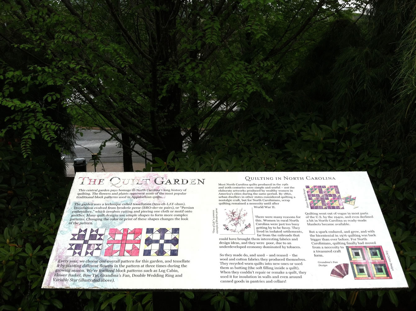 A sign explains the concepts and techniques used to create the quilt garden at the North Carolina Arboretum in Asheville, N.C.