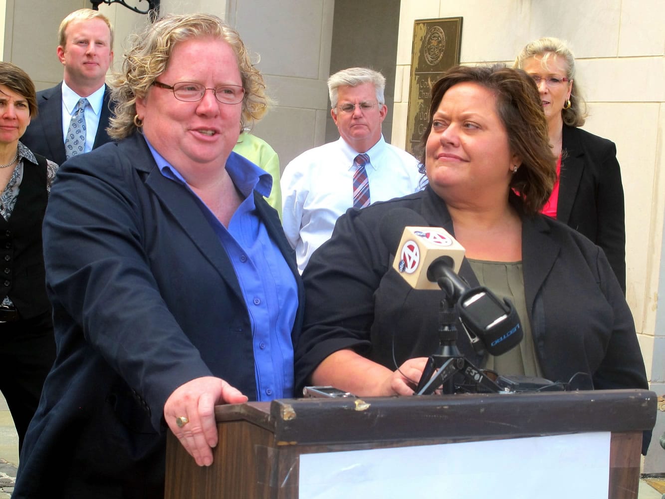 Colleen Condon, left, and her partner Nichols Bleckley appear at a news conference Oct.
