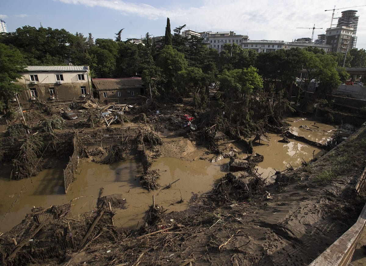 A destroyed, flooded zoo area is seen Monday in Tbilisi, Georgia.