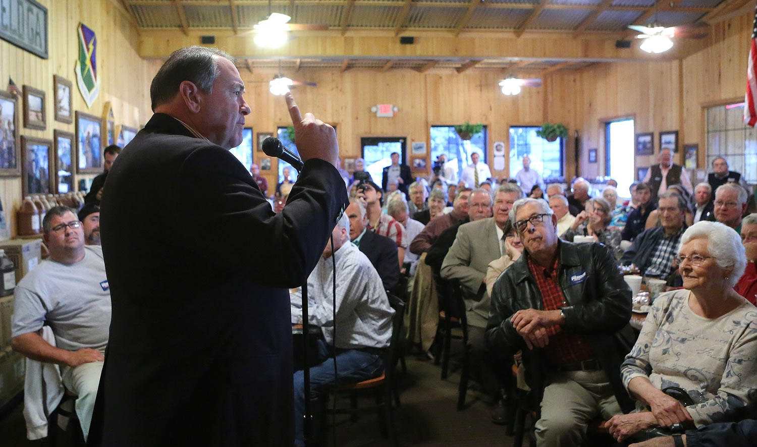 Gov. Mike Huckabee speaks to supporters of David Perdue senate campaign at the Smok'n Pig restaurant on  Oct.