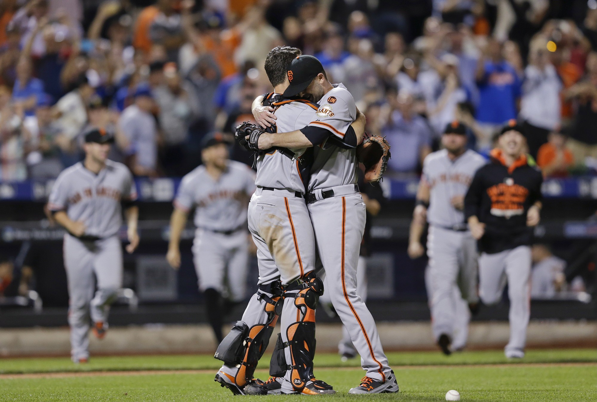 San Francisco Giants starting pitcher Chris Heston hugs catcher Buster Posey, left, after Heston's no-hitter against the New York Mets on Tuesday.