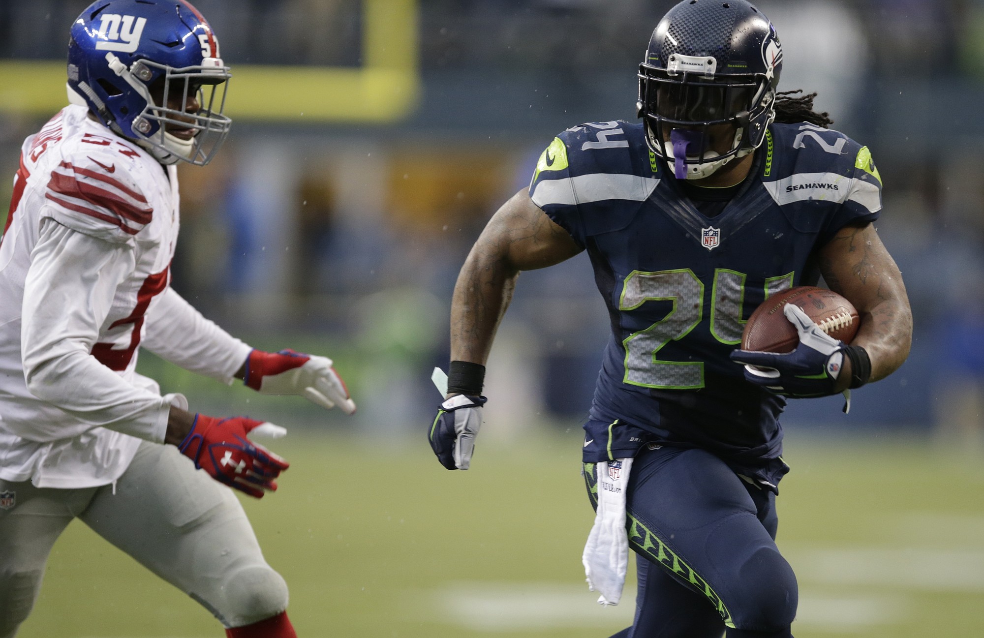 Seattle Seahawks running back Marshawn Lynch runs against the New York Giants in the second half Sunday, Nov. 9, 2014, in Seattle.