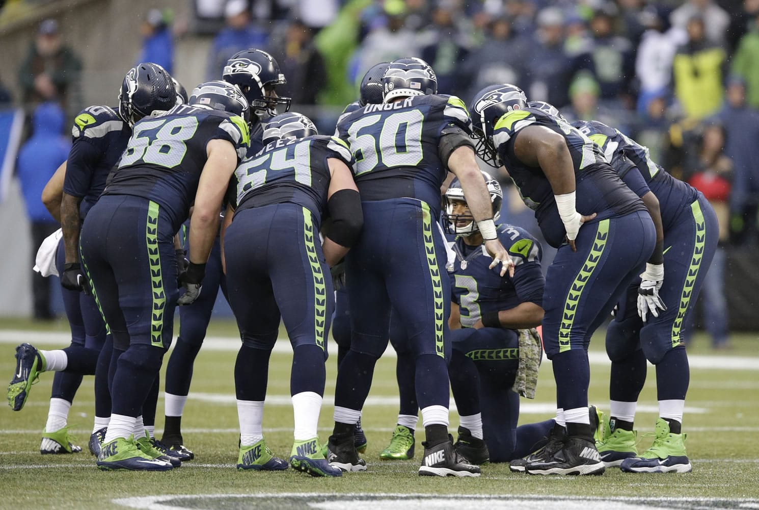 Seattle Seahawks quarterback Russell Wilson (3) huddles up the offense against the New York Giants in the second half Sunday, Nov. 9, 2014, in Seattle.