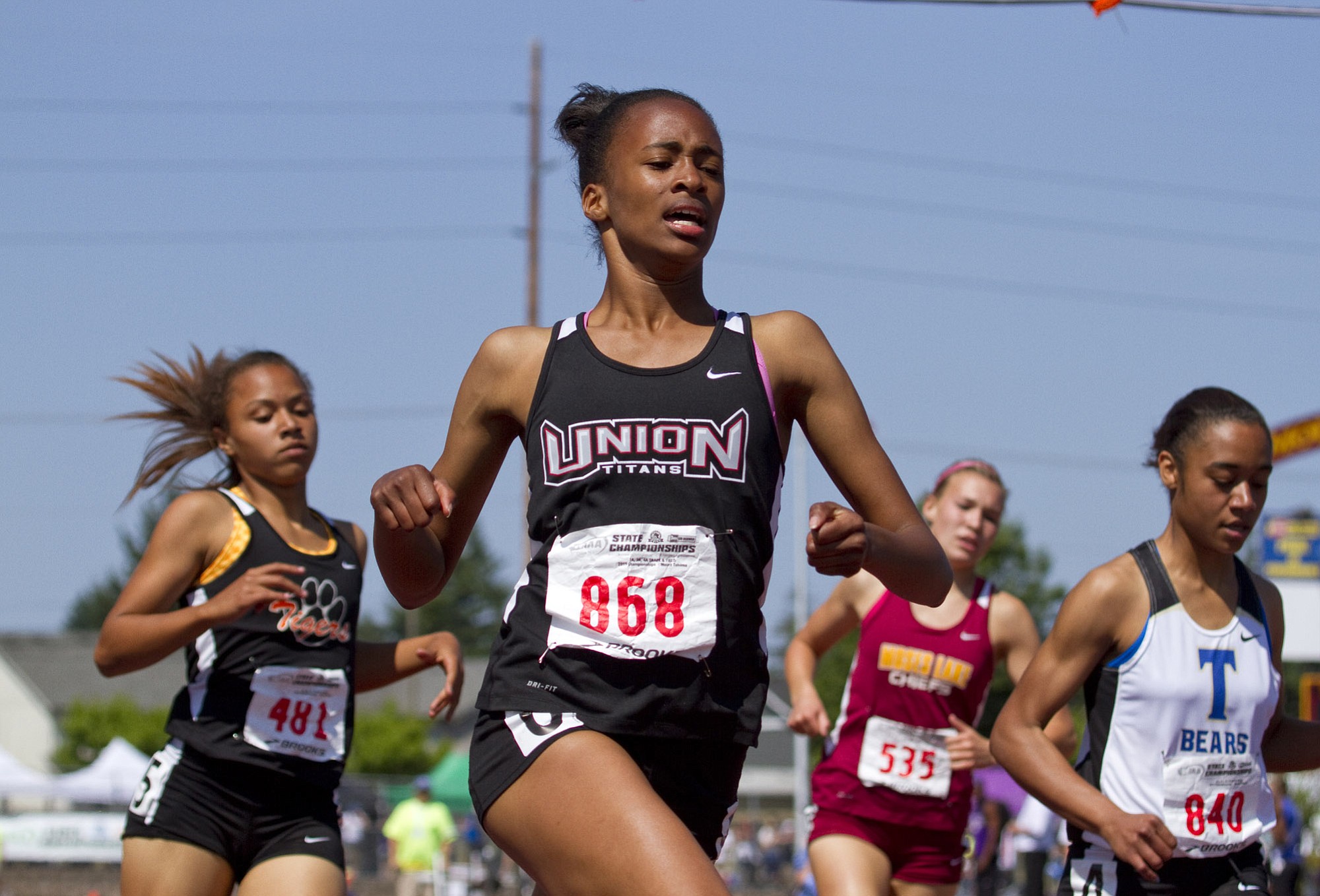 Union sophomore Dai'lyn Merriweather crosses the finish line to win the 4A girls 200 meters at the state track and field championships Saturday in Tacoma (Patrick Hagerty/For The Columbian)