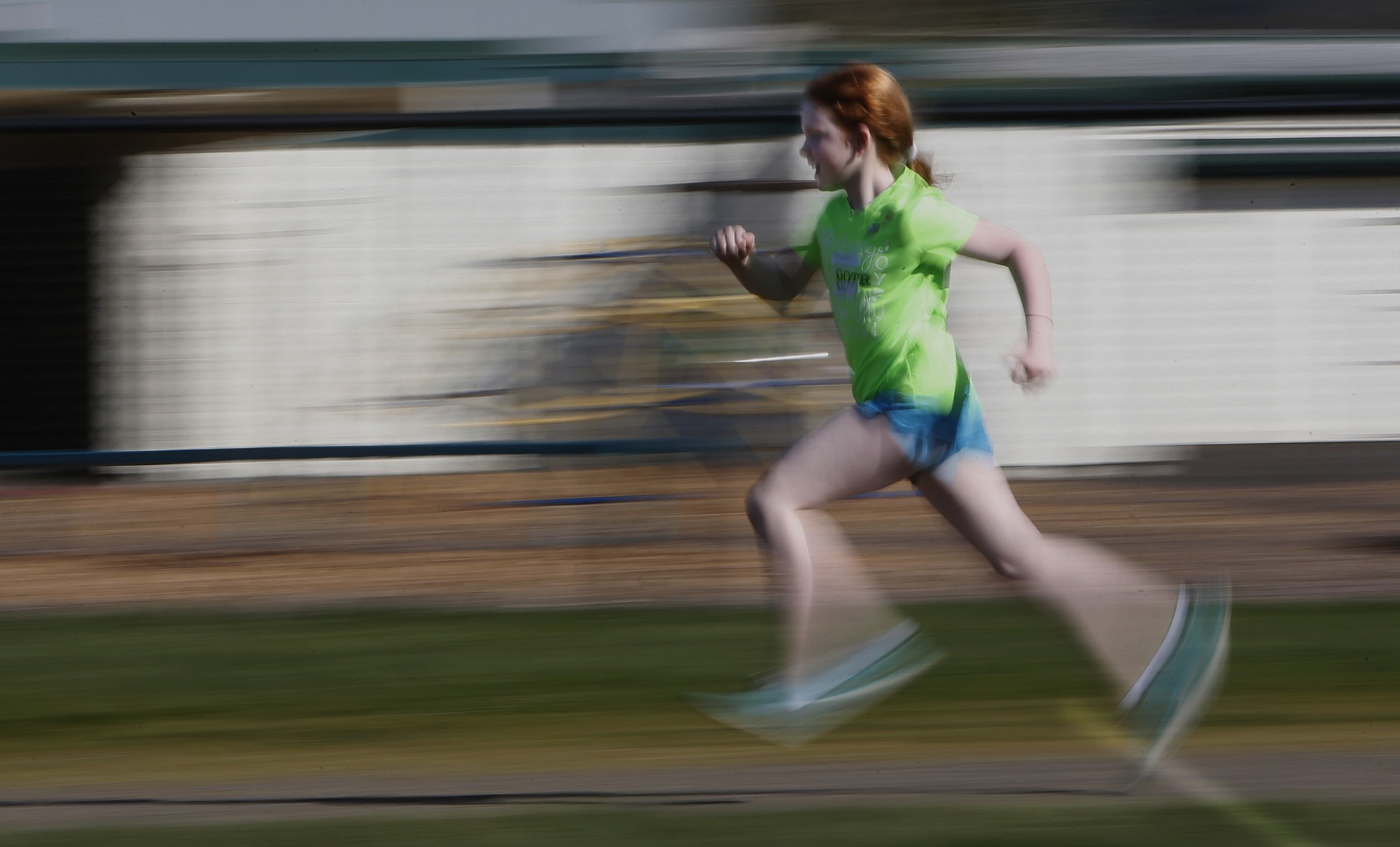 Anneliese Lewis, a fourth-grader at Coburg Community Charter School in Coburg, Ore., runs a lap around the school's track during Girls on the Run practice on March 12.