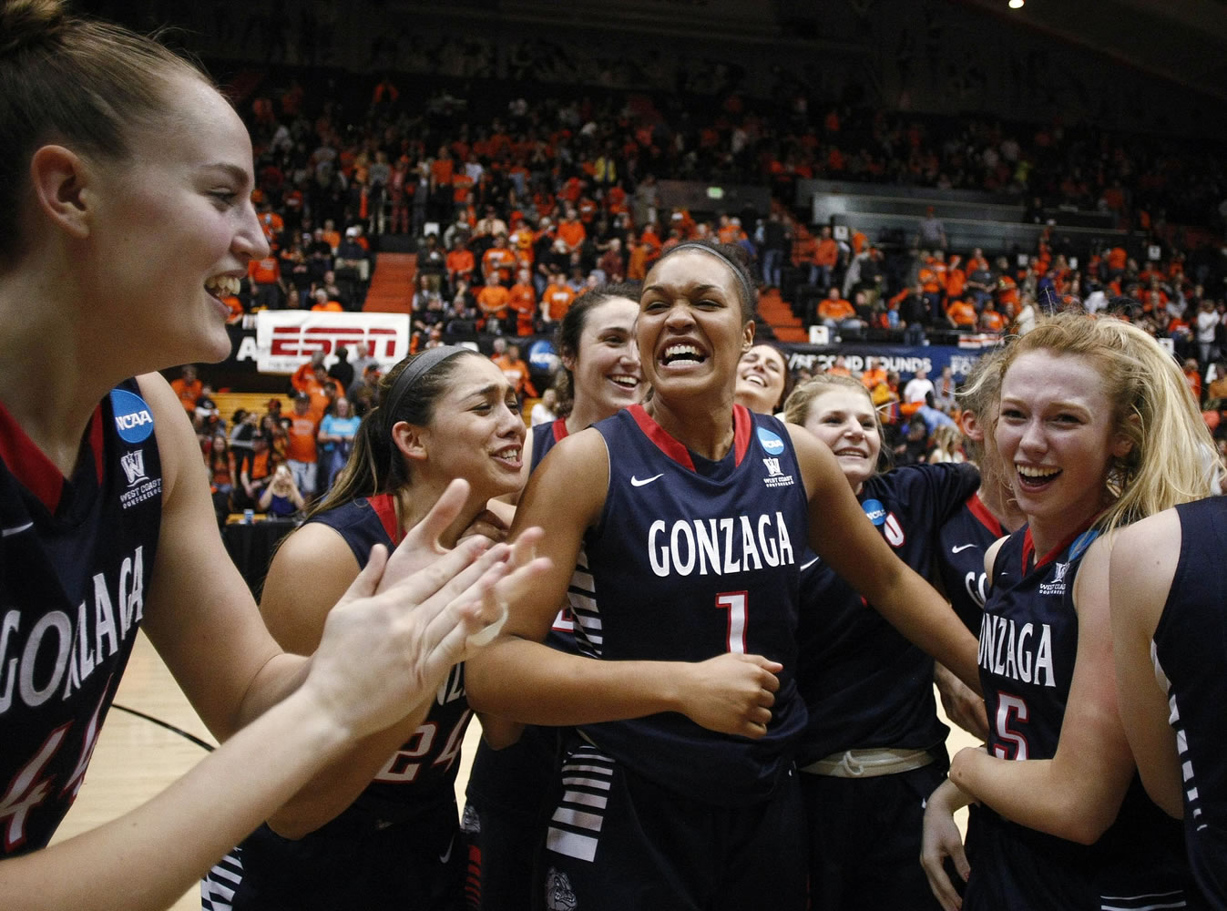 Gonzaga's Shelby Chelsea, Keani Albanez, Chelsea Waters and Georgia Stirton, from left, celebrate after Gonzaga defeated Oregon State 76-64 in the second round of the NCAA tournament in Corvallis, Ore., Sunday, March 22, 2015.