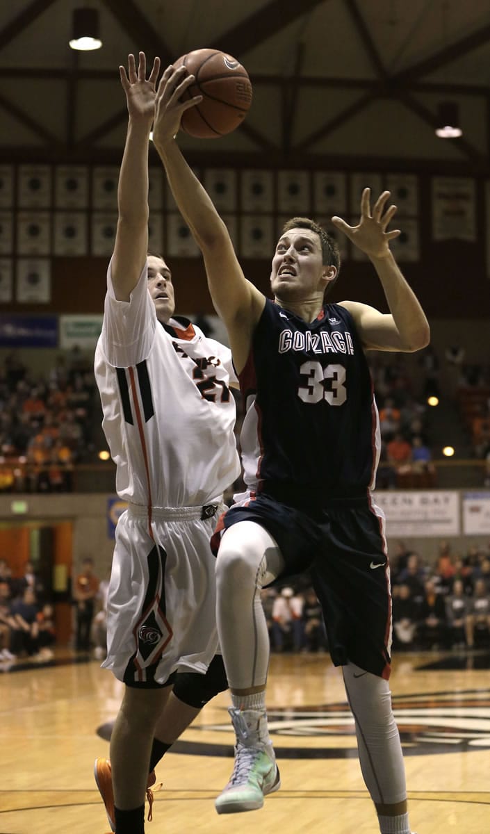 Gonzaga forward Kyle Wiltjer, right, drives to the basket against Pacific forward Jacob Lampkin during the second half Thursday, Feb. 19, 2015 in Stockton, Calif. Gonzaga won 86-74.