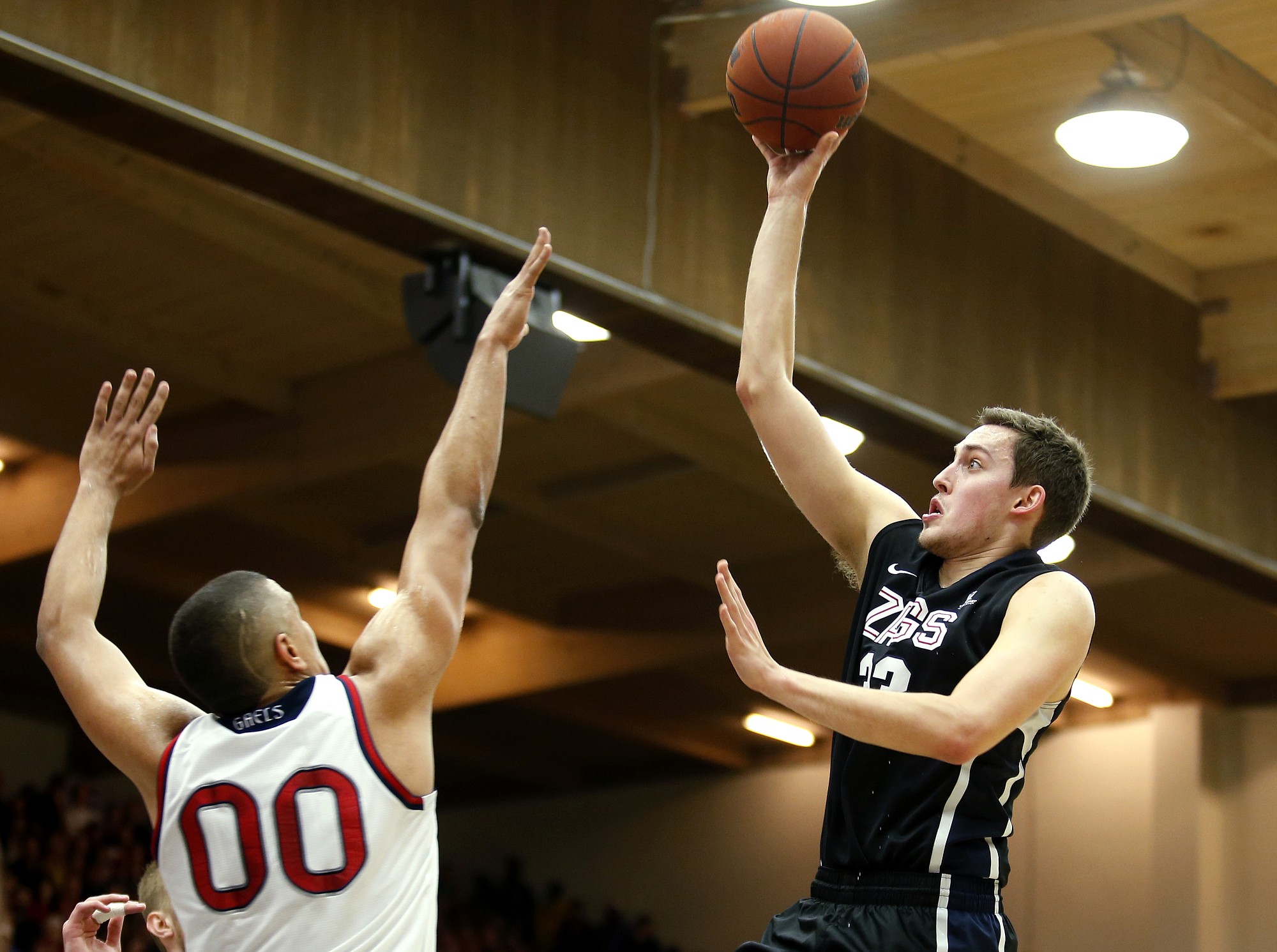 Gonzaga forward Kyle Wiltjer, right, shoots the ball over St. Mary's forward Brad Waldow during the first half  Saturday, Feb. 21, 2015, in Moraga, Calif. Gonzaga defeated St. Mary's 70-60.