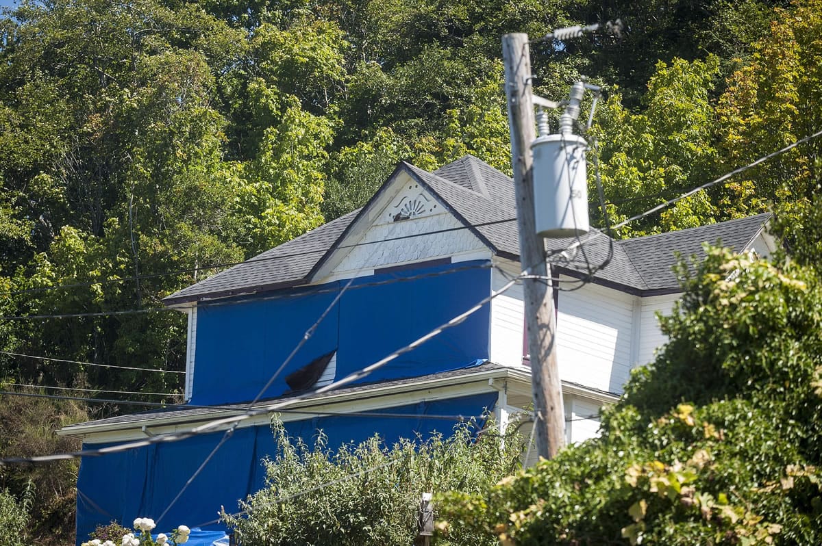 Tthe home featured in the 1985 classic &quot;The Goonies&quot; is covered in blue tarps to deter fans from getting too close to the house, in Astoria, Ore.