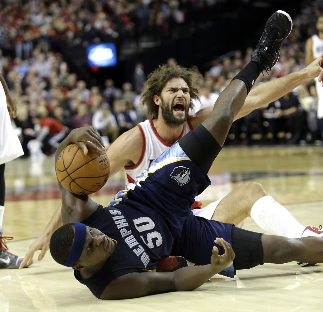Portland Trail Blazers center Robin Lopez, reacts after he is called for fouling Memphis Grizzlies forward Zach Randolph during Portland's loss on Friday.