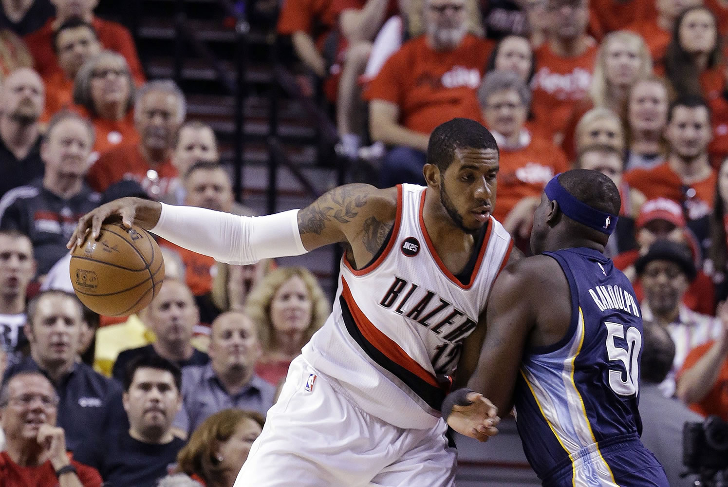 Portland Trail Blazers forward LaMarcus Aldridge, left, works the ball in against Memphis Grizzlies forward Zach Randolph during the first half of Game 4 in Portland on Monday, April 27, 2015.