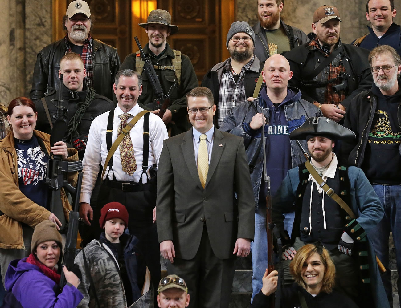 Washington Rep. Matt Shea, R-Spokane Valley, center, poses for a group photo with gun owners on  Jan.