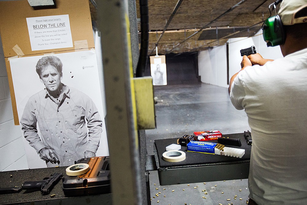A patron of Champion Arms shooting range in Kent  takes aim at a target.