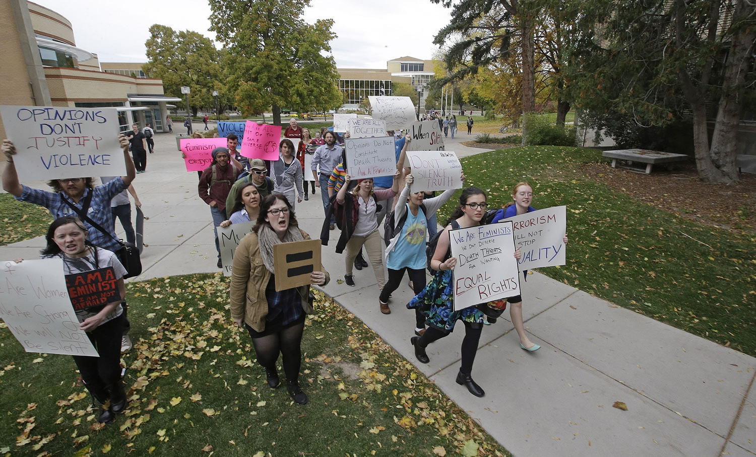 Students protest Wednesday on the campus of Utah State University in Logan, Utah.