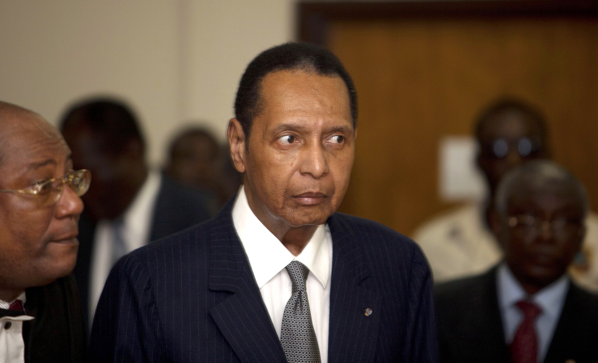 Former Haitian dictator Jean-Claude Duvalier, known as &quot;Baby Doc,&quot; attends his hearing Feb. 28, 2013 at court in Port-au-Prince, Haiti, as Haitian authorities charged Duvalier with human rights abuses and embezzlement but a judge ruled he should face charges only for the alleged financial crimes.