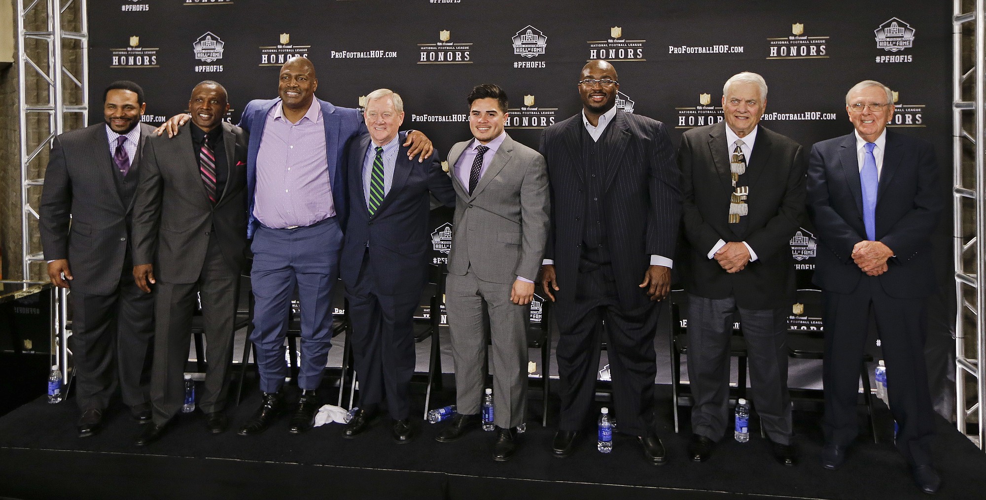Members of the Pro Football Hall of Fame class of 2015 are introduced Saturday, Jan. 31, 2015, in Tempe, Ariz. From left are running back Jerome Bettis; wide receiver Tim Brown; defensive end and linebacker Charles Haley; Bill Polian; Tyler Seau, son of the late linebacker Junior Seau, on behalf of his father; guard Will Shields; center Mick Tingelhoff; and Ron Wolf.