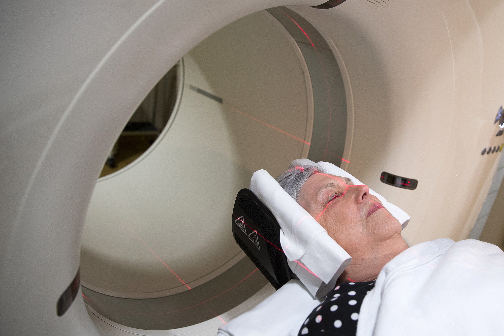 Judith Chase Gilbert, of Arlington, Va., is loaded into a PET scanner May 19 at Georgetown University Hospital in Washington.