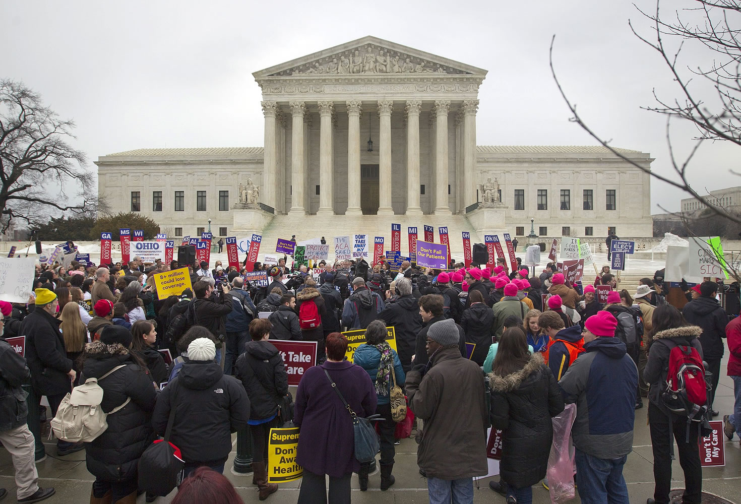 A crowd gathers outside the Supreme Court in Washington, as the court hears arguments in King v. Burwell.