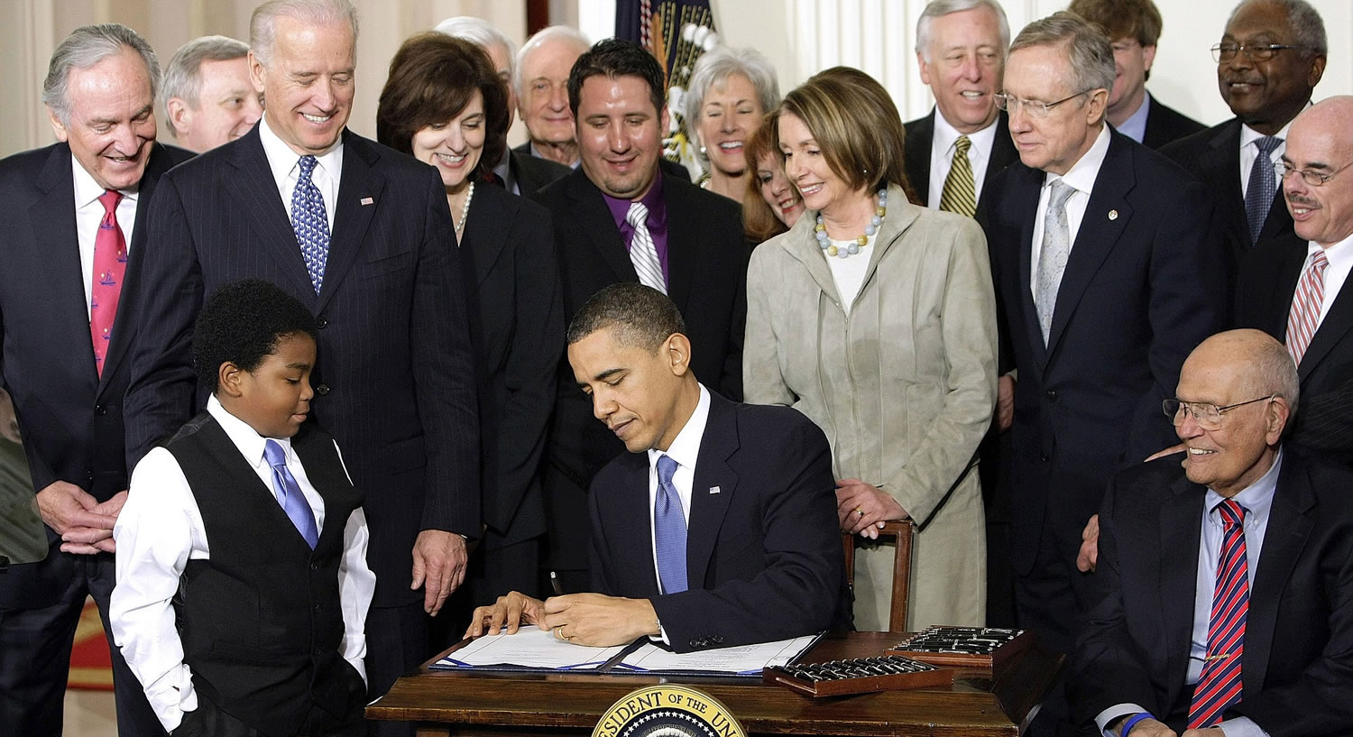 President Barack Obama signs the health care bill in 2010  in the East Room of the White House in Washington.