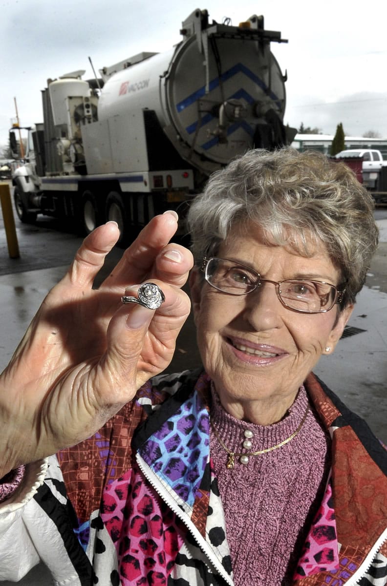 Pat Hanson, 90, shows her heirloom ring that a service crew was able to recover from the sewer system in Medford, Ore.