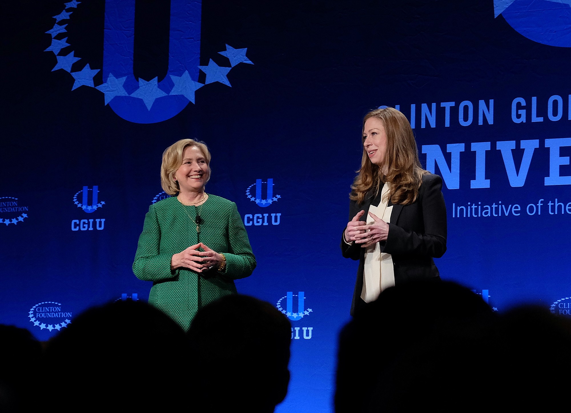 Former Secretary of State Hillary Rodham Clinton, left, and Chelsea Clinton speak Saturday at a university conference sponsored by their Clinton Global Initiative at the University of Miami, in Coral Gables, Fla.