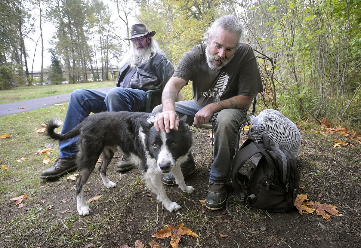 Andy Cripe/Corvallis Gazette-Times
Richard &quot;Stretch&quot; McCain, left, and Bob Brokaw hang out with Bob's dog, Lucas, near the Corvallis, Ore., skate park.