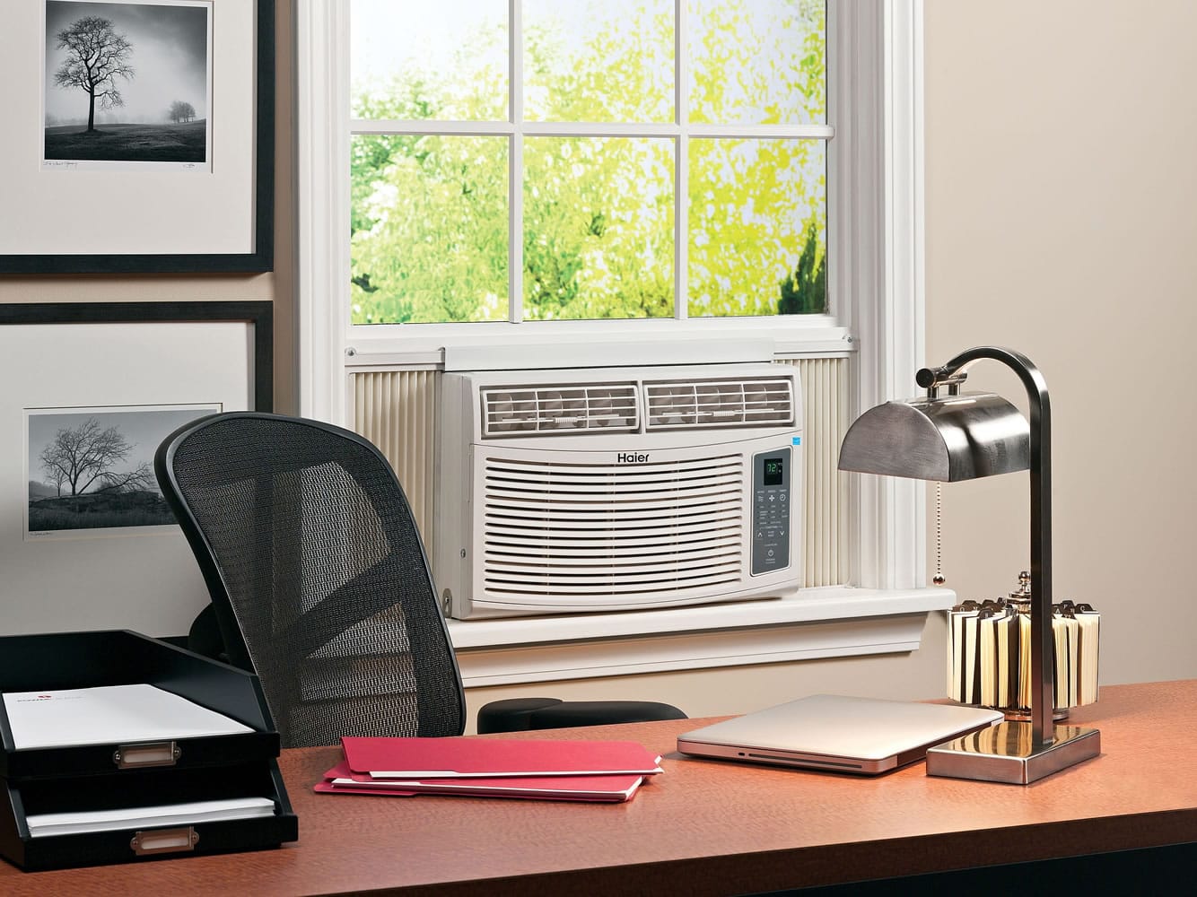 Haier America
An Energy Star-qualified room air conditioner offers comfort in an office. A little savvy about when to open windows and when to keep them covered does much to cool a home, as does putting thought into what appliances to use and when, the experts say.