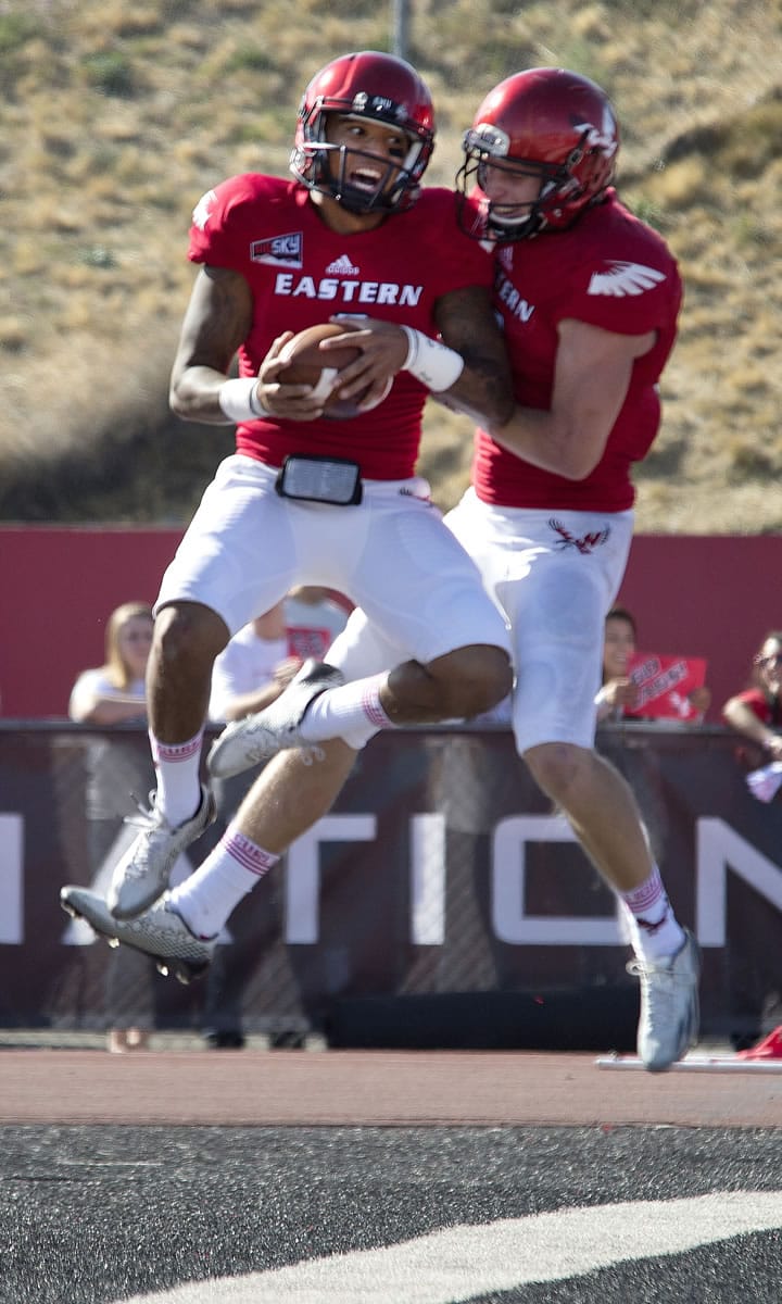 Eastern Washington quarterback Vernon Adams, left, celebrates his touchdown with wide receiver Cooper Kupp against Idaho State during the first quarter Saturday, Oct. 4, 2014, in Cheney.