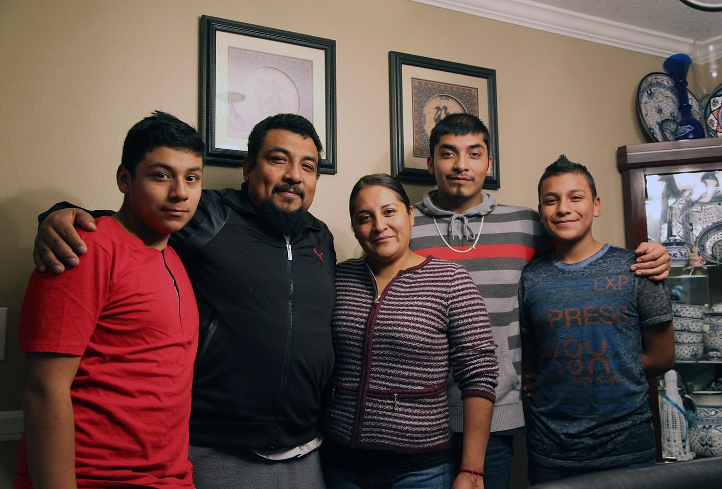 The Romero-Morales family, from left, Kevin, Jorge, Clara, Alan, and Naethan, lives in Aloha, Ore. The parents, Clara and Jorge, will likely qualify for relief from deportation, because two of their sons are U.S.