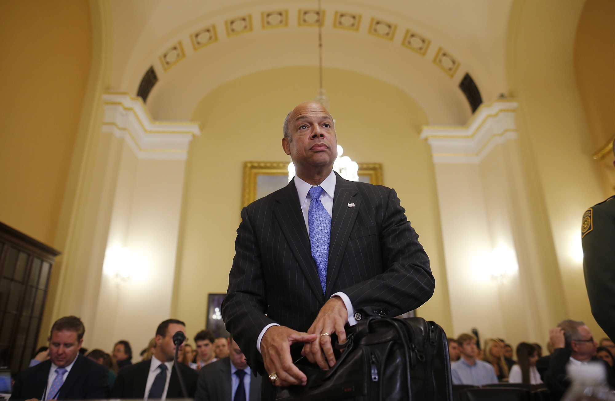 Homeland Security Secretary Jeh Johnson arrives to testify before the House Committee on Homeland Security on Capitol Hill in Washington about the growing problem of unaccompanied children crossing the border into the United States.