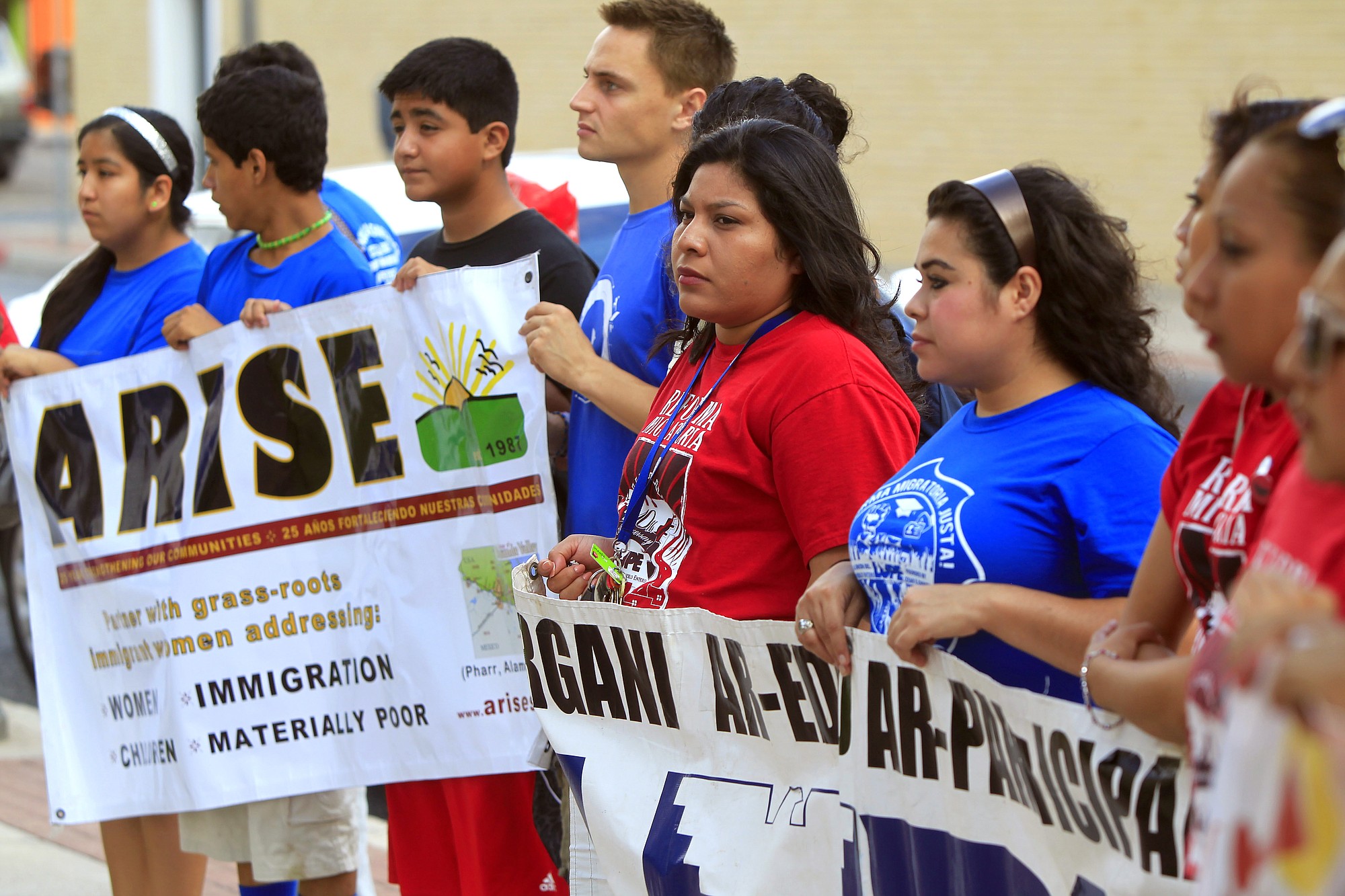 Immigrant advocates attend a vigil to show support for the refugee children and families arriving in the Rio Grande Valley and to draw attention to the causes and solutions to the refugee crisis Friday at the Sacred Heart Catholic Church in McAllen, Texas.