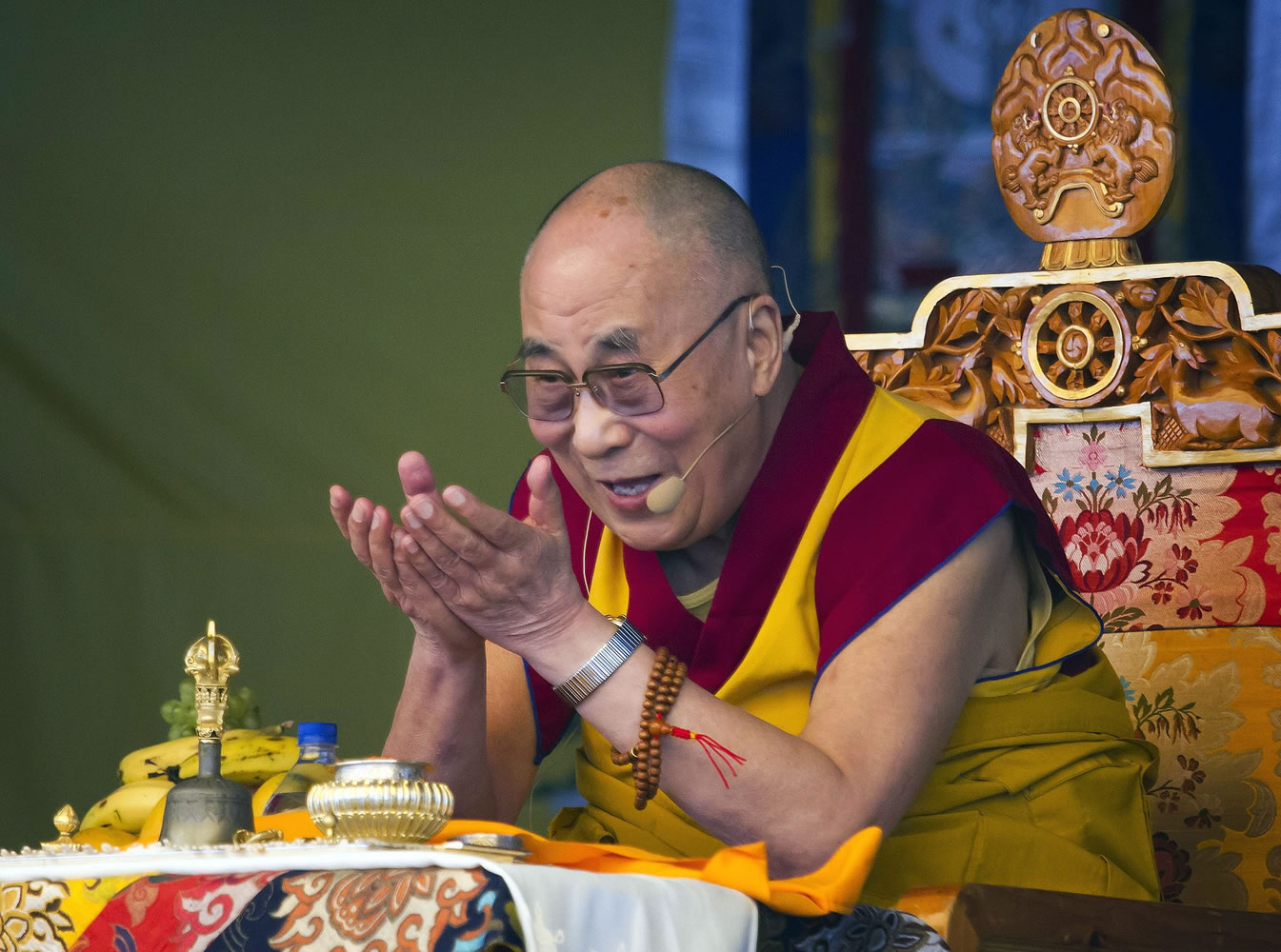 Tibetan spiritual leader the Dalai Lama gestures as he talks during a special ritual ceremony at the Tibetan Children's Village School in Dharmsala, India.