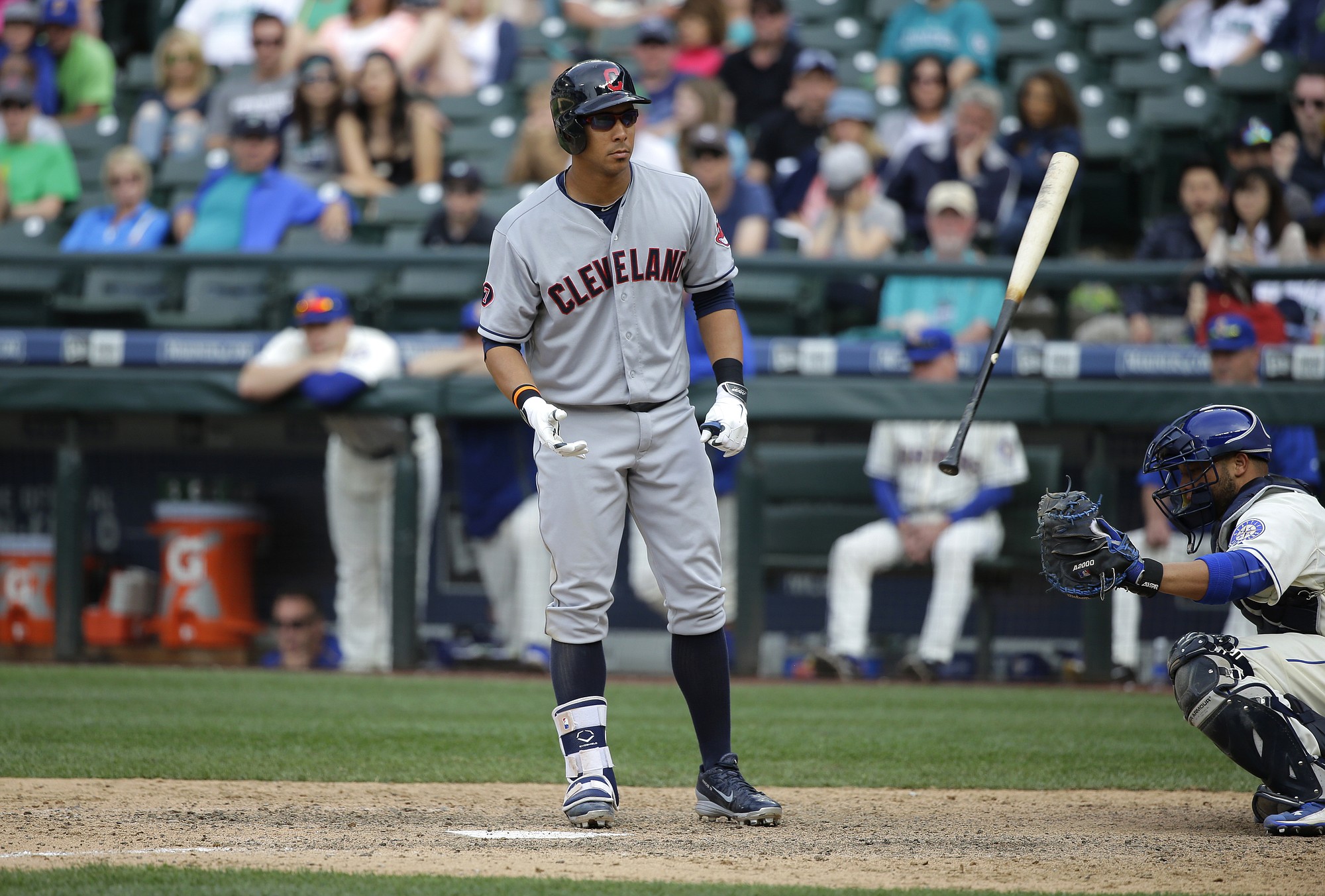 Cleveland Indians' Michael Brantley tosses his bat after he was walked with the bases loaded in the 12th inning  Seattle Mariners, Sunday, May 31, 2015, in Seattle. The Indians beat the Mariners 6-3 in 12 innings. (AP Photo/Ted S.