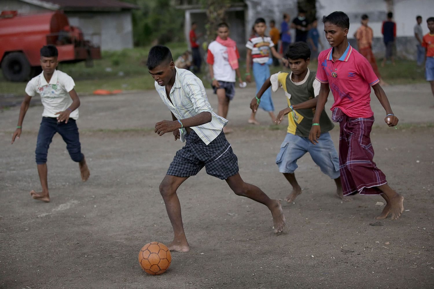 Ethnic Rohingya men play soccer Friday at their temporary shelter in Langsa, Aceh province, Indonesia. Thousands of refugees and migrants have washed ashore in Malaysia, Indonesia and Thailand, according to the International Organization for Migration. Half are Rohingya and the rest are from Bangladesh, the IOM said. The U.N. refugee agency estimates more than 3,000 others may still be at sea.