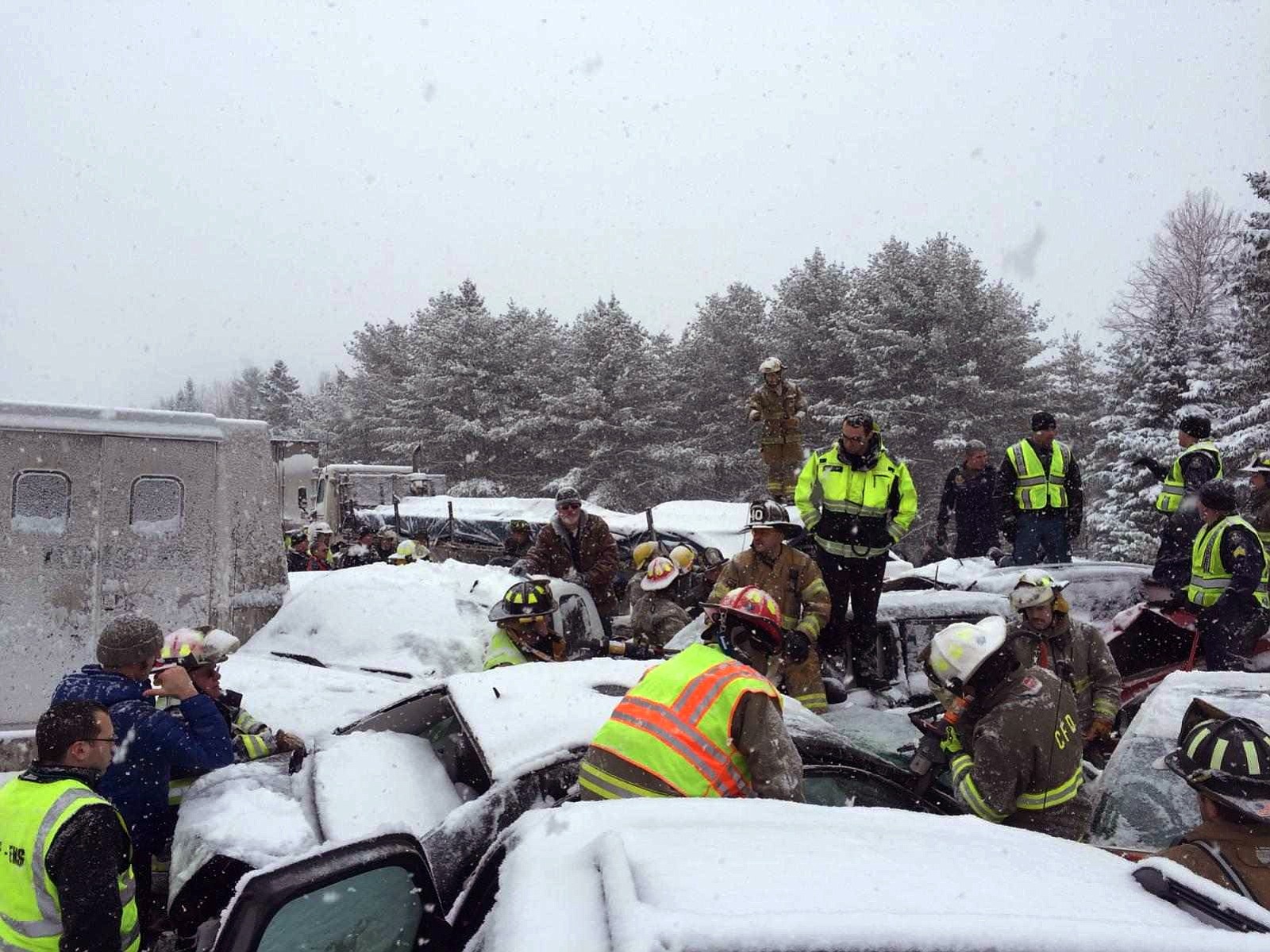 Emergency personnel respond to a multivehicle pileup on Interstate 95 near Bangor, Maine, on Wednesday.