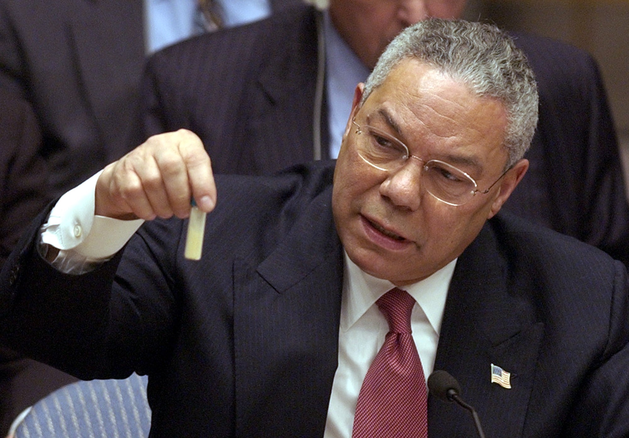 U.S. Secretary of State Colin Powell holds up a vial that he said could contain anthrax during a meeting of the United Nations Security Council at the United Nations headquarters on Feb.