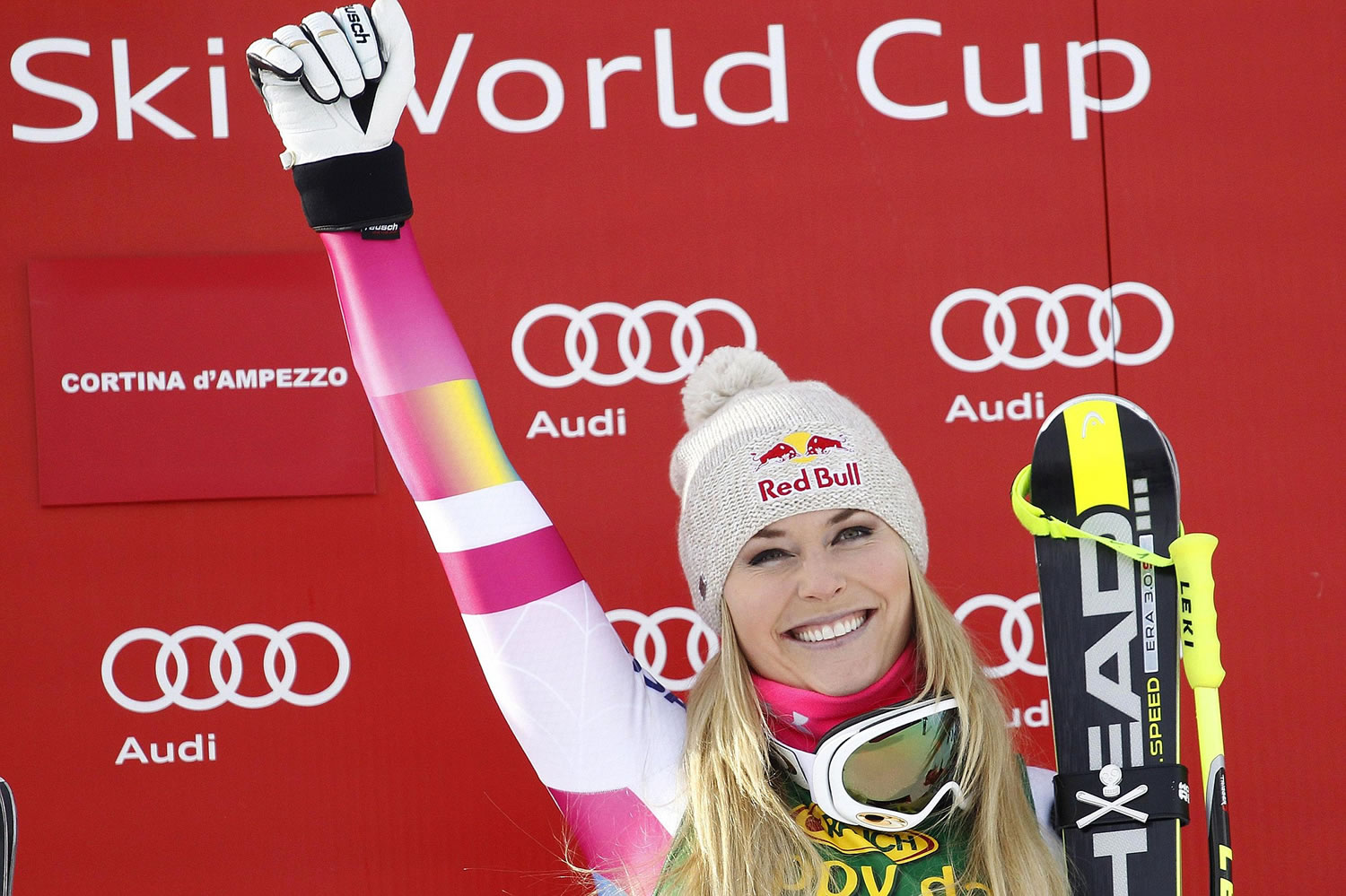 Lindsey Vonn celebrates on the podium after winning an alpine ski, women's World Cup super-G, in Cortina d'Ampezzo, Italy, Monday, Jan. 19, 2015. Lindsey Vonn won a super-G Monday for her record 63rd World Cup victory.